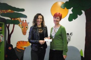 Helen handing cheque to Moya compressed